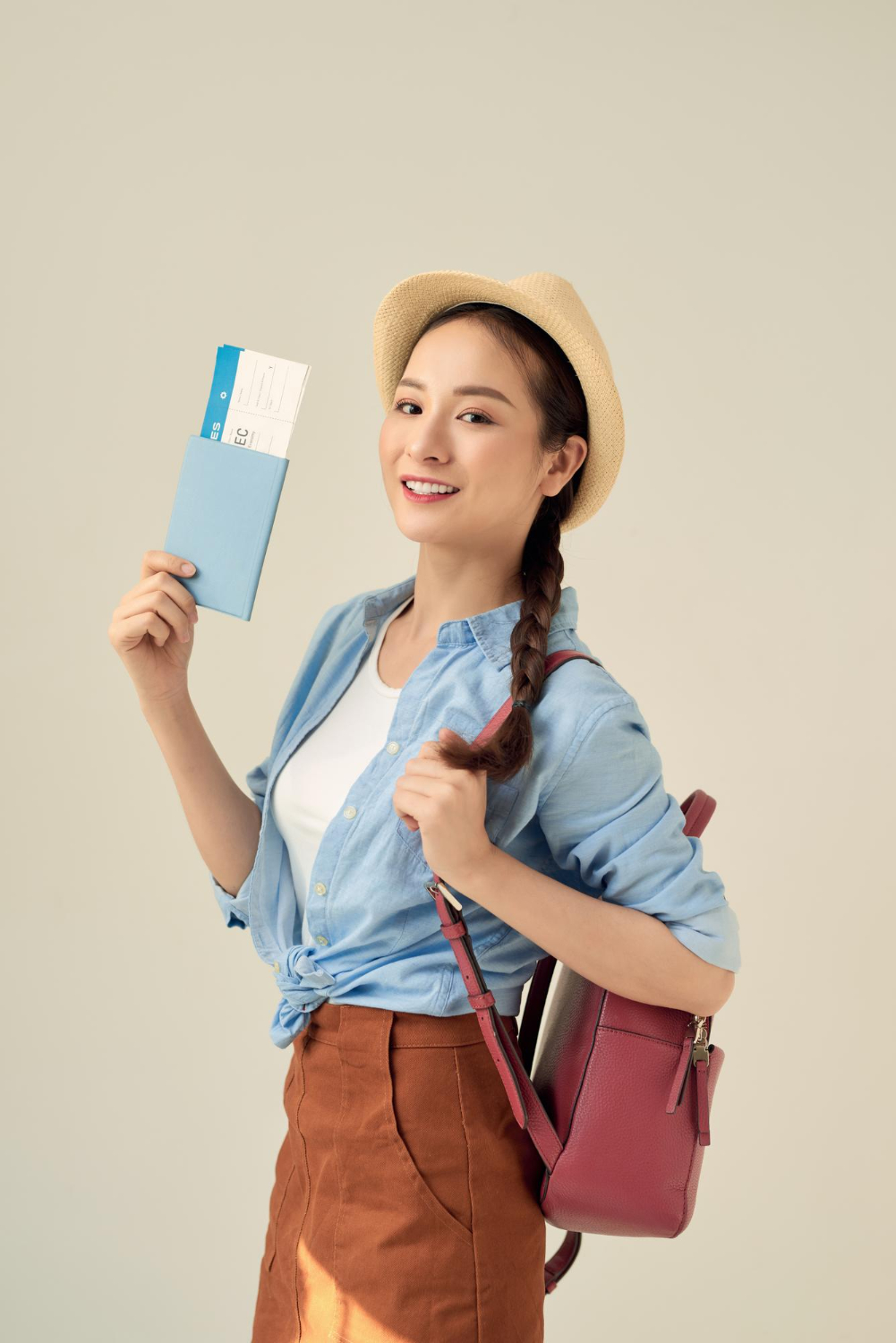 happy-young-woman-holds-passport-prepares-journey-likes-travelling